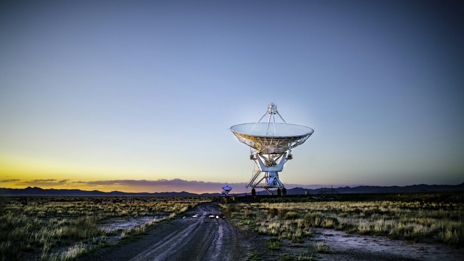 A radio telescope dish at dusk