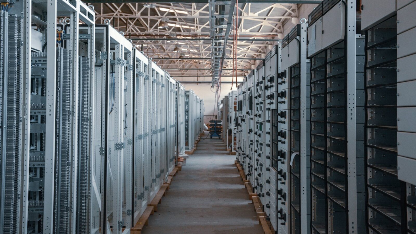 A server room aisle lined with equipment racks