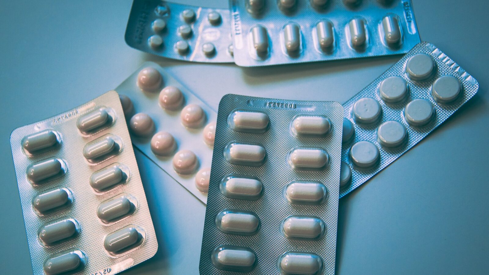 Blister packs of white and blue tablets