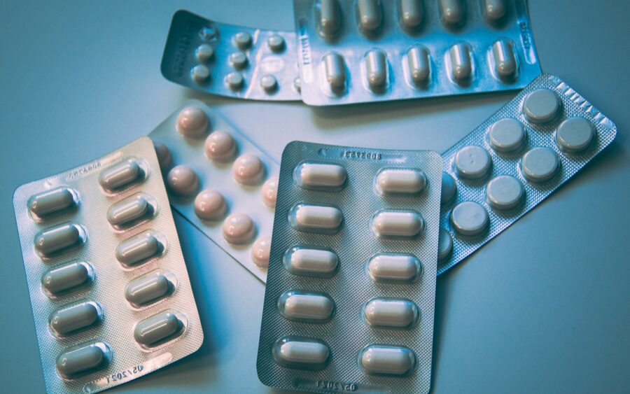 Blister packs of white and blue tablets