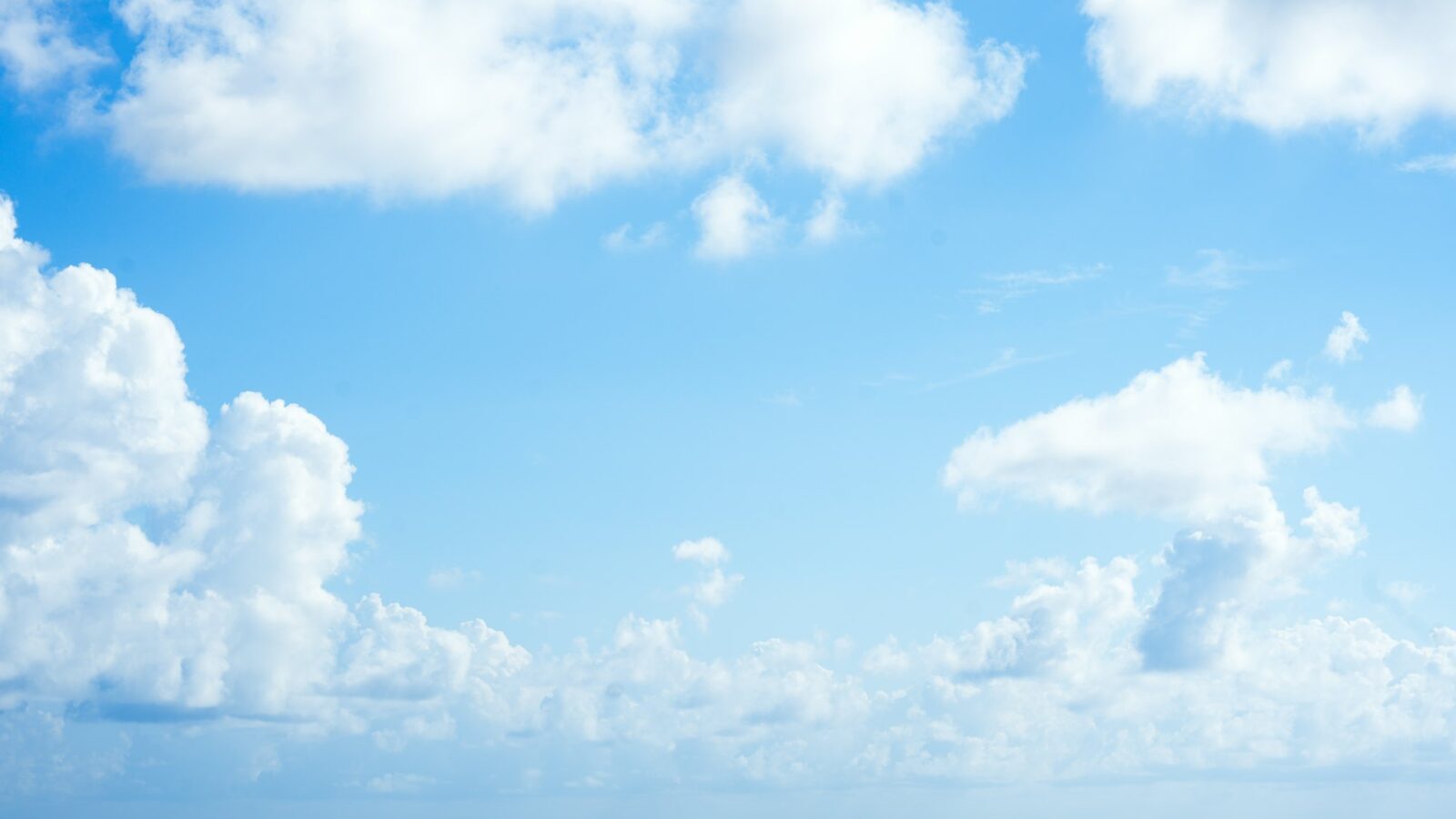 White clouds over a dark ocean