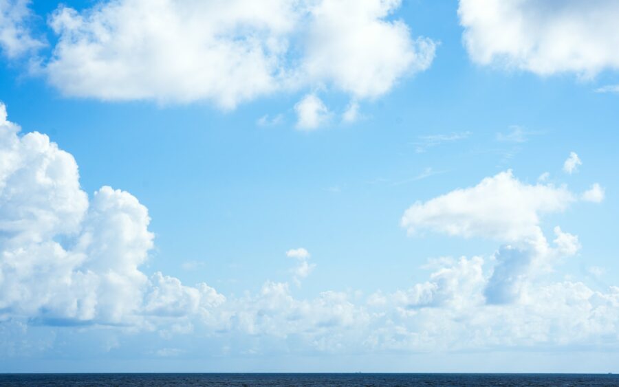 White clouds over a dark ocean