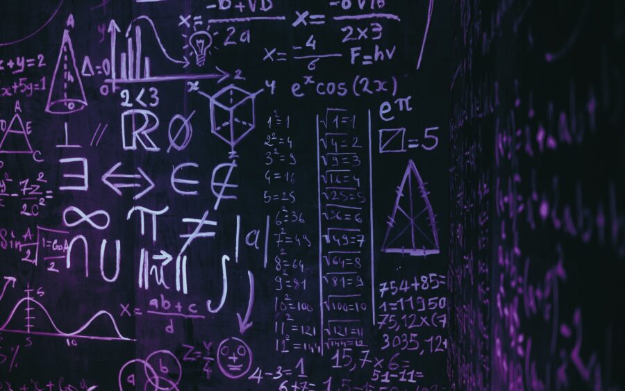 A blackboard covered in mathematical formulas